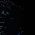 Computer monitor showing structured data on a dark screen