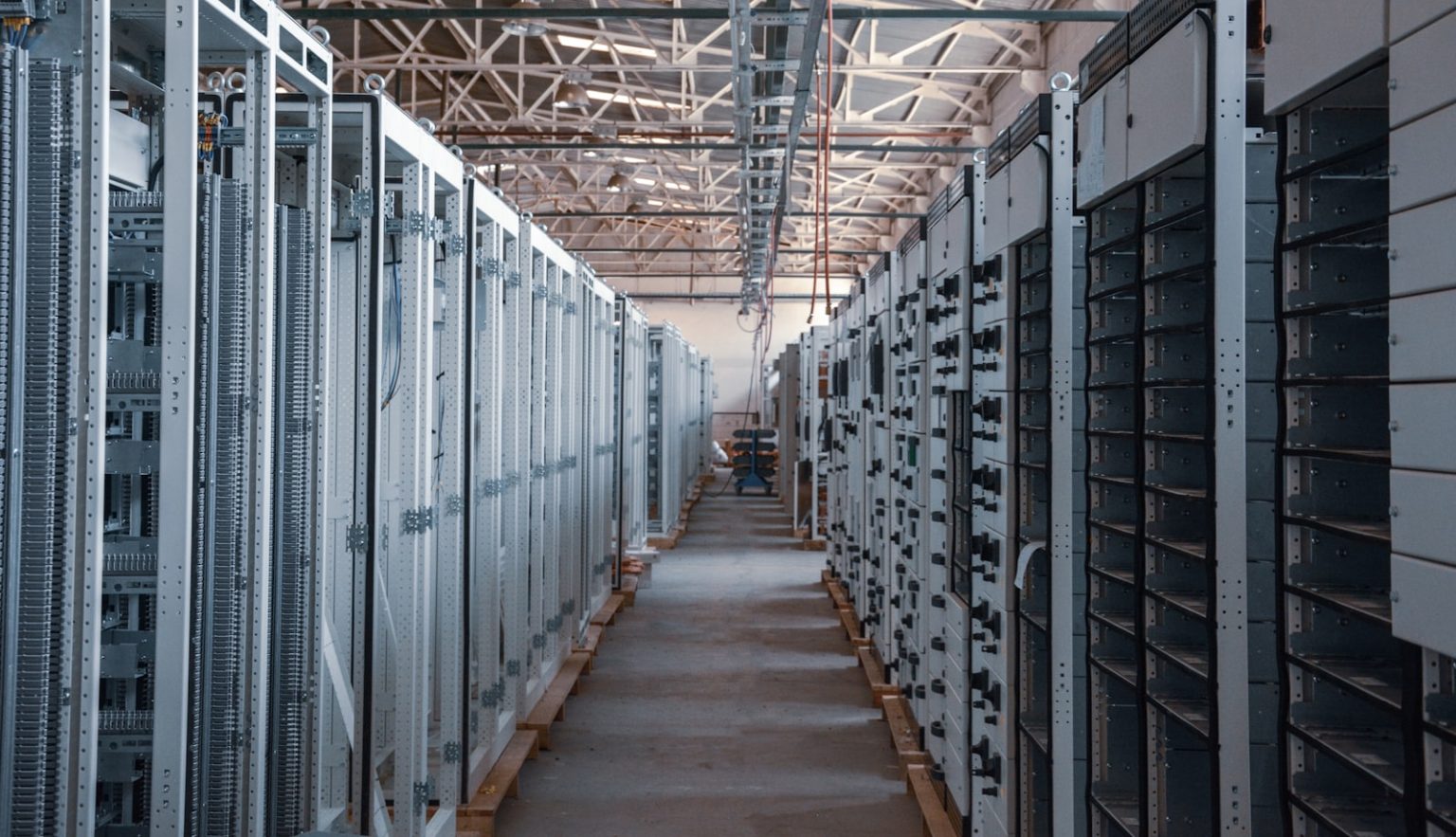 Data center aisle lined with metal server racks