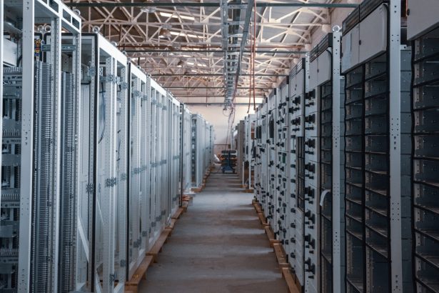 Data center aisle lined with metal server racks