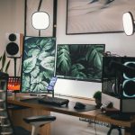 Home office desk with a laptop set up beside a window for focused work