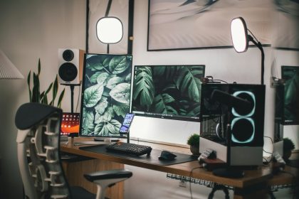 Home office desk with a laptop set up beside a window for focused work