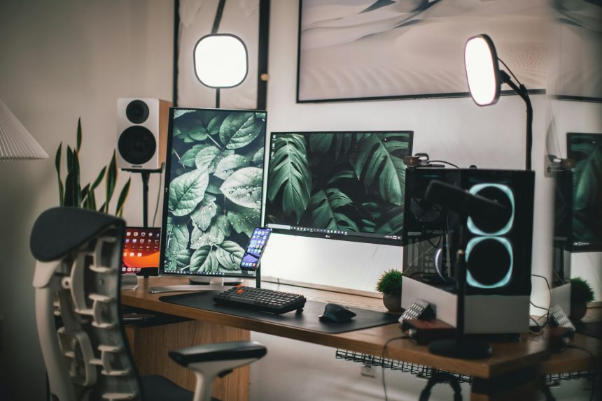 Home office desk with a laptop set up beside a window for focused work
