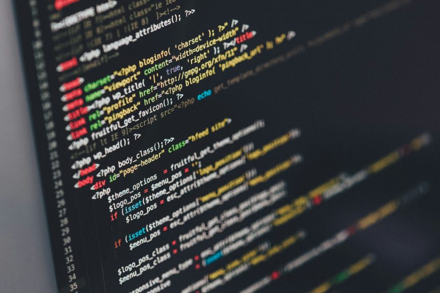 Developer monitor displaying lines of application source code