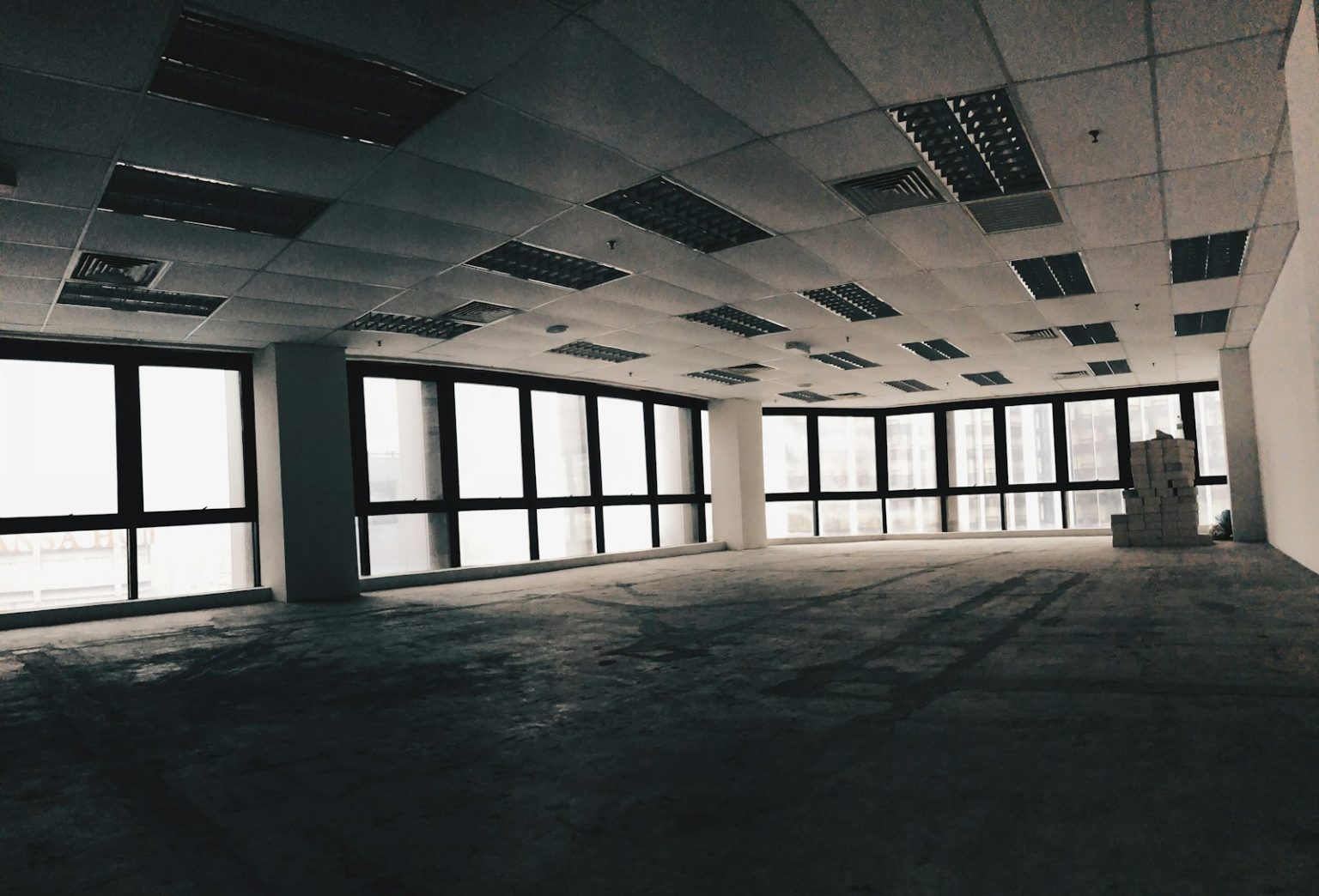 Empty office room with desks at the end of the working day